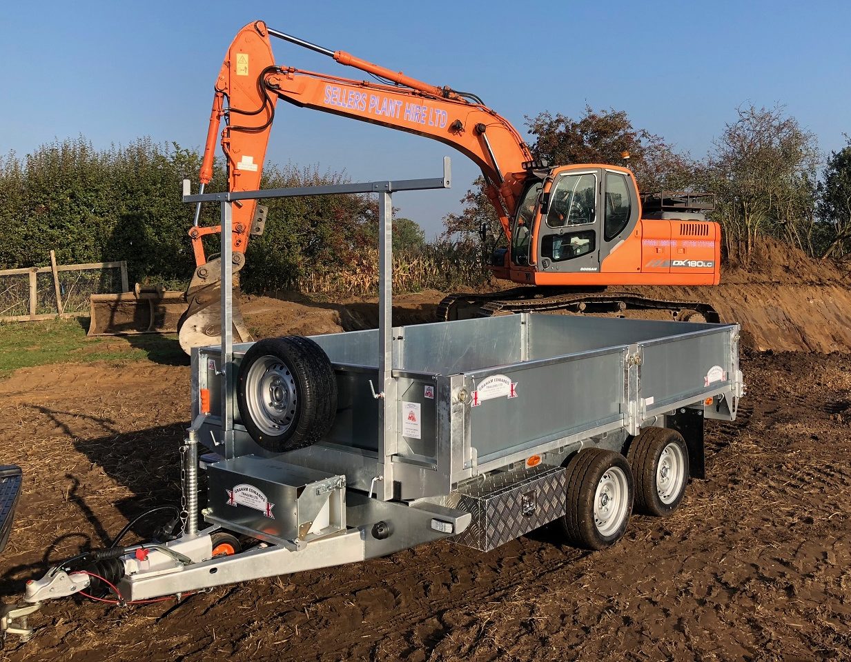 Tipping Trailer being used for earth removal with a digger